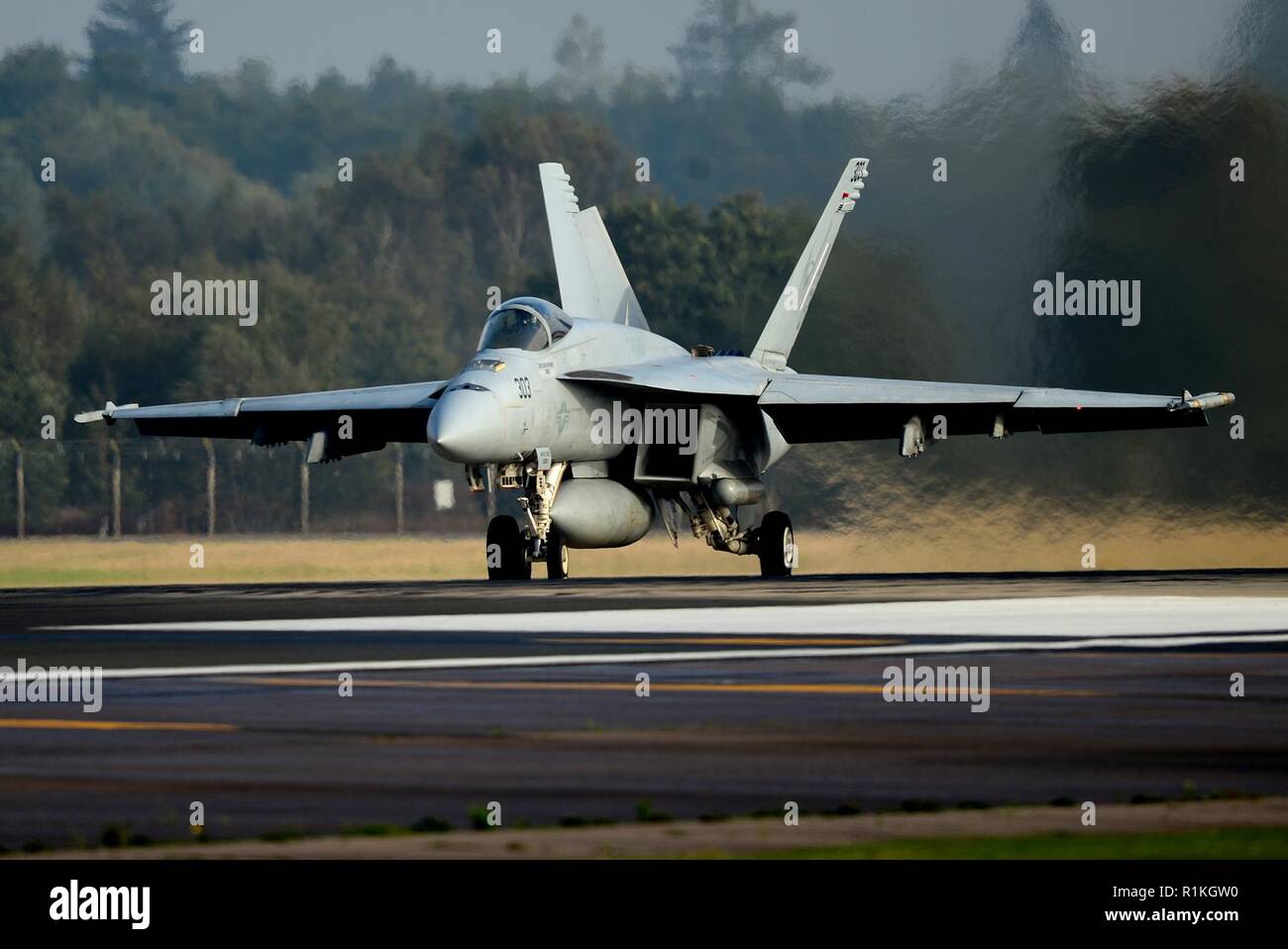 An F/A-18E Super Hornet assigned to Carrier Air Wing One (CVW-1), deployed from the Nimitz-class aircraft carrier USS Harry S. Truman (CVN 75) launches for a joint training sortie at Royal Air Force Lakenheath, England, Oct. 16, 2018. The carrier is currently operating in the U.S. 6th Fleet area of operations, fostering cooperation with regional allies and partners, strengthening regional stability, and remaining vigilant, agile and dynamic. Stock Photo