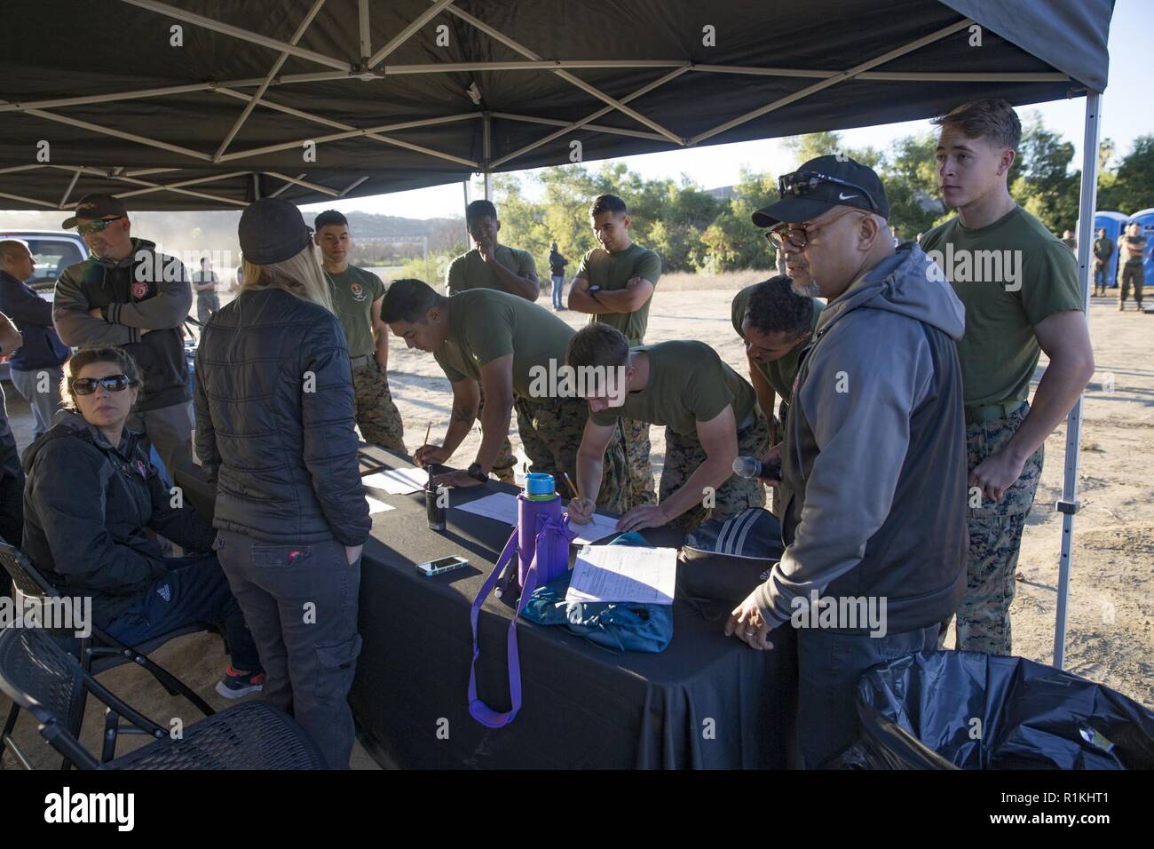 U.S. Marines register for the Fire Team Challenge, which was held as a part of the Commanding General’s Cup (CG Cup) at Lake O’Neill, Marine Corps Base Camp Pendleton, California, Oct. 17, 2018. The CG’s Cup is an intramural sports program that was developed to give service members from various units across MCB Camp Pendleton an opportunity to compete in organized sporting events in order to promote fitness, teamwork and esprit de corps. The CG’s cup also allows service members to earn points for their units, resulting in prizes and awards that are presented to the top-earning units at the con Stock Photo