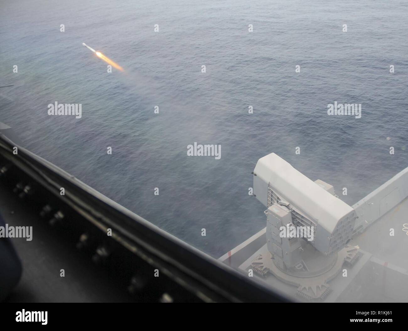ATLANTIC OCEAN (Oct. 14, 2018) Amphibious transport dock ship USS Arlington (LPD 24) fires a rolling airframe missile (RAM) during a live fire missile exercise for the Carrier Strike Group (CSG) 4 composite training unit exercise (COMPTUEX). COMPTUEX is the final pre-deployment exercise that certifies the combined Kearsarge Amphibious Ready Group (ARG) and the 22nd Marine Expeditionary Unit’s (MEU) planning and execution of challenging and realistic training scenarios. CSG 4 mentors, trains and assesses East Coast units preparing for future deployments. Stock Photo