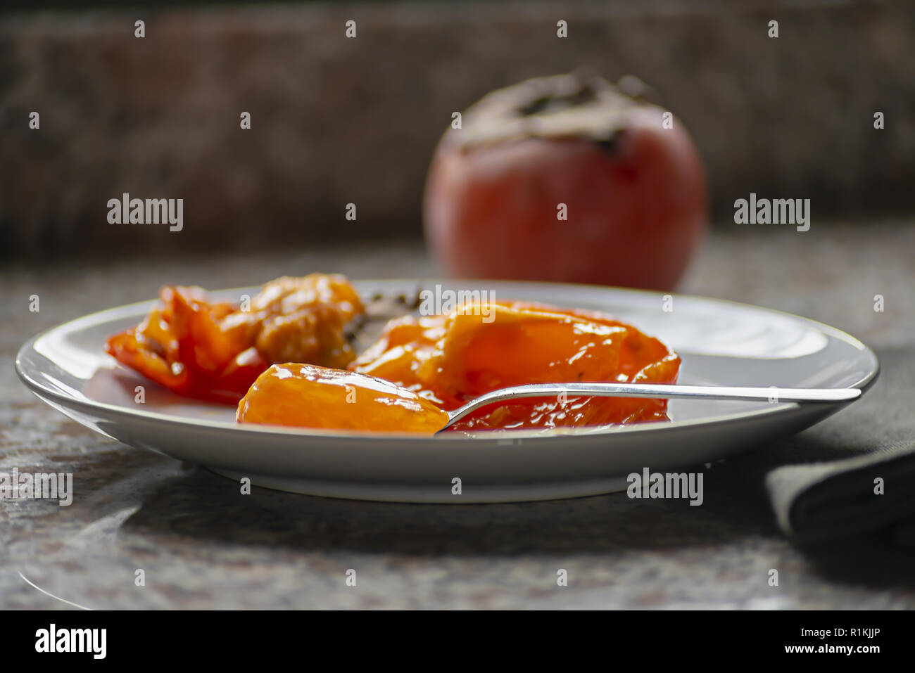 kaki fruit in the dish ate almost everything from the low flame forward Stock Photo