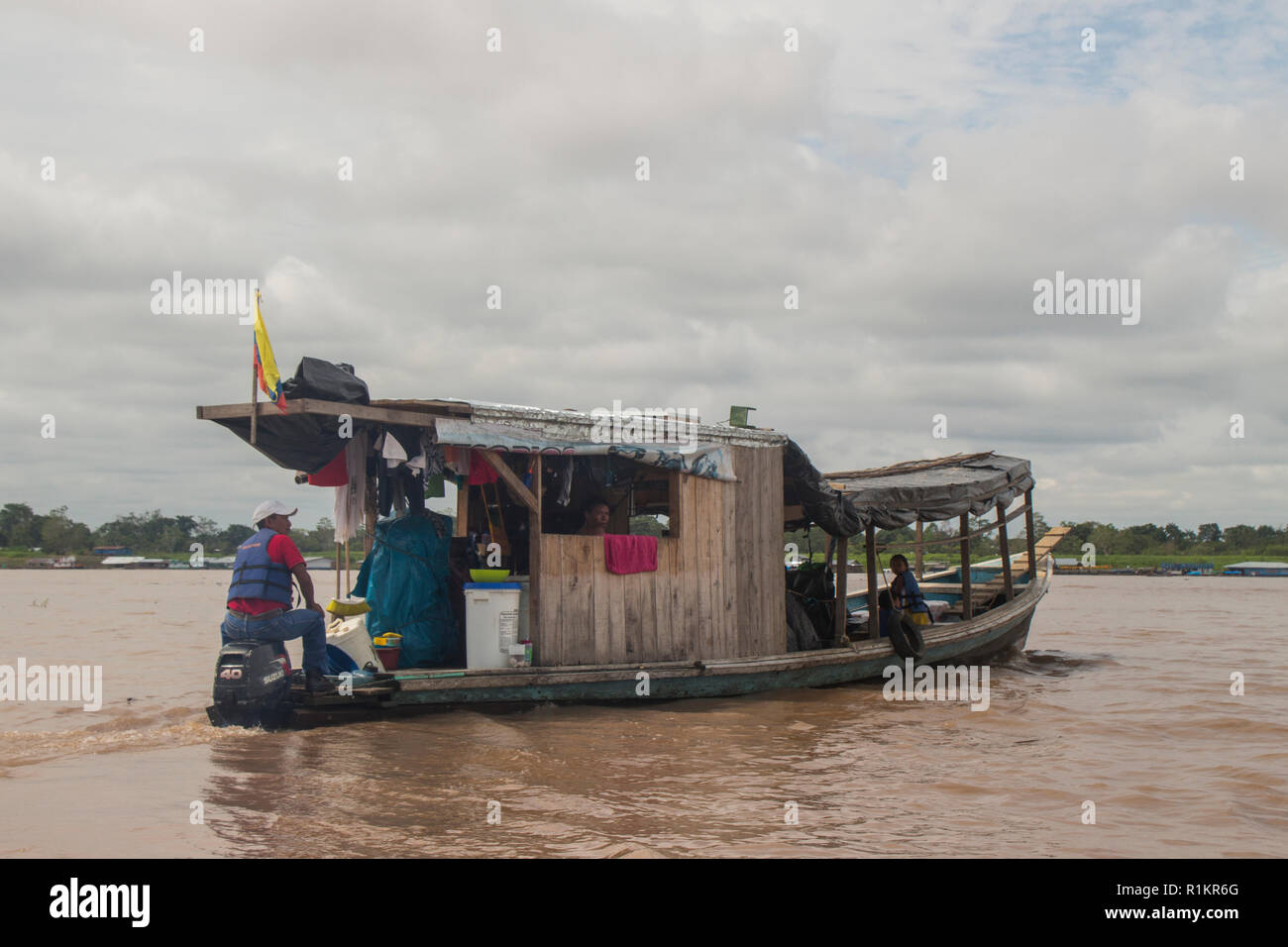 Leticia, Amazon river, Colombia - 10/12/2015, house boat cruising down the Amazon river near the town of Leticia Stock Photo
