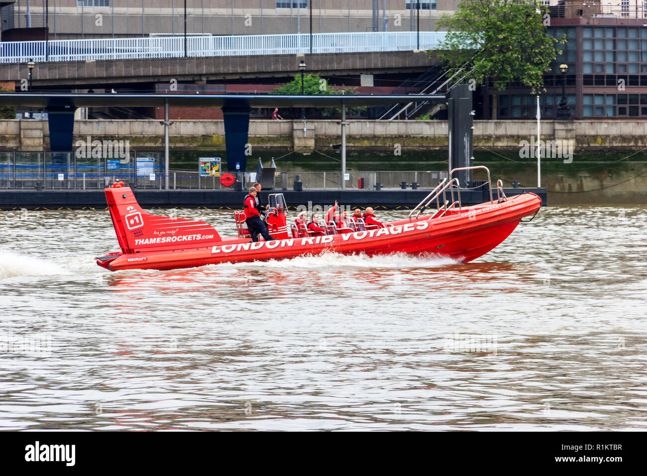 Red high speed 'London RIB Voyages' sightseeing boat on the River Thames at Blackfriars, London, UK Stock Photo