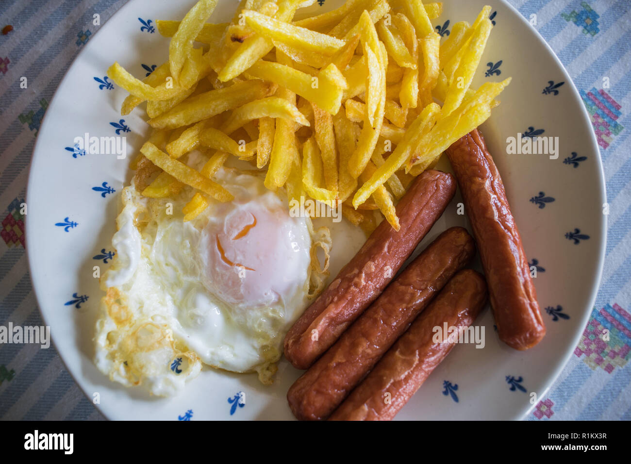 Fried potatoes with egg and sausages Stock Photo Alamy