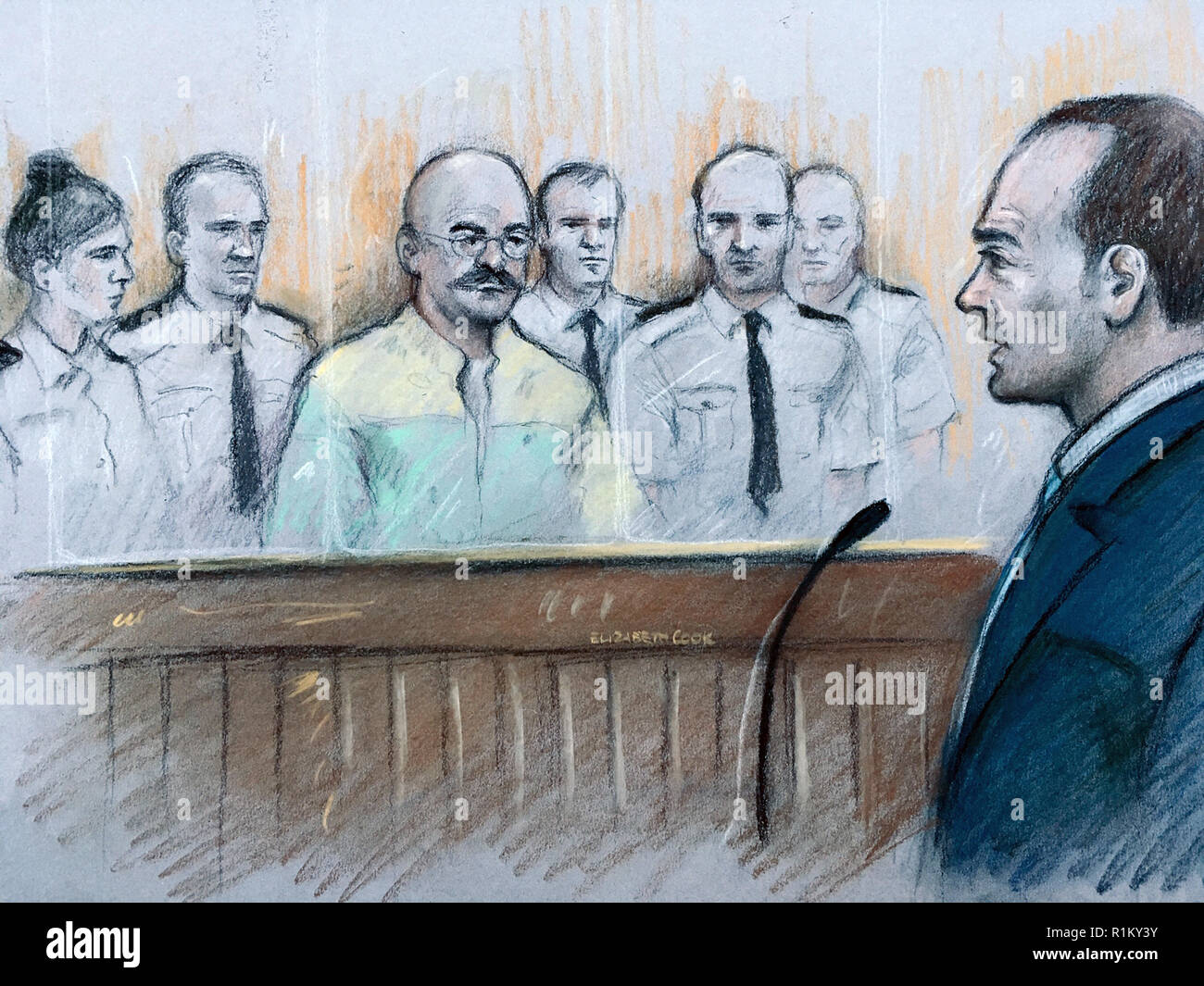 Court artist sketch by Elizabeth Cook of notorious inmate Charles Bronson, listening as prison governor Mark Docherty (right) gives evidence at Leeds Crown Court, after Bronson launched himself at Mr Docherty at HMP Wakefield in January threatening to gouge his eyes out prior to a welfare meeting. Stock Photo