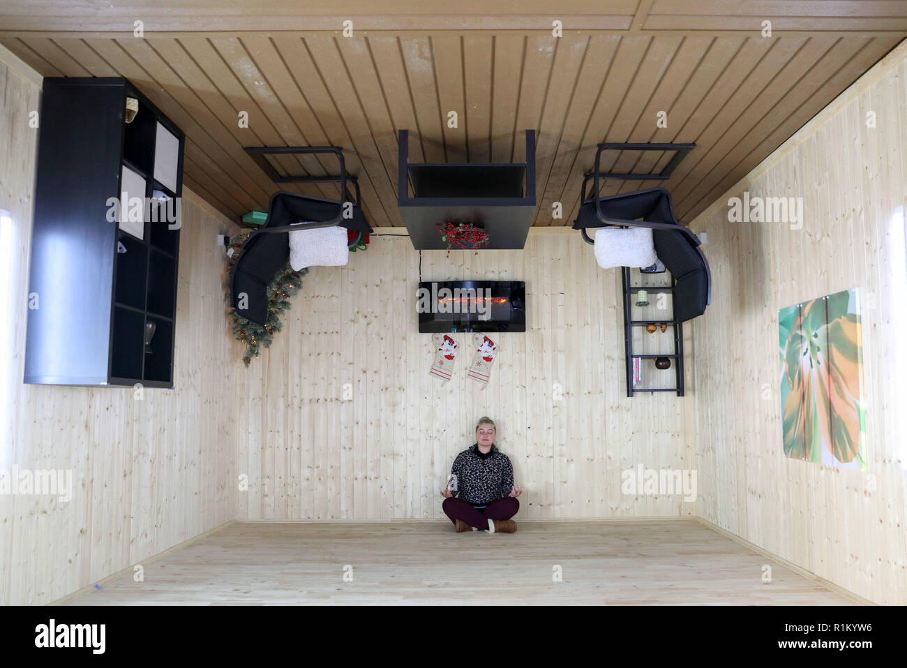 An Employee In One Of The Rooms In The Upside Down House
