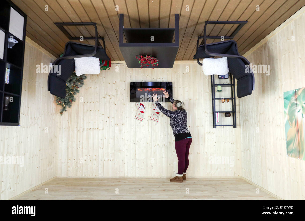 An Employee In One Of The Rooms In The Upside Down House
