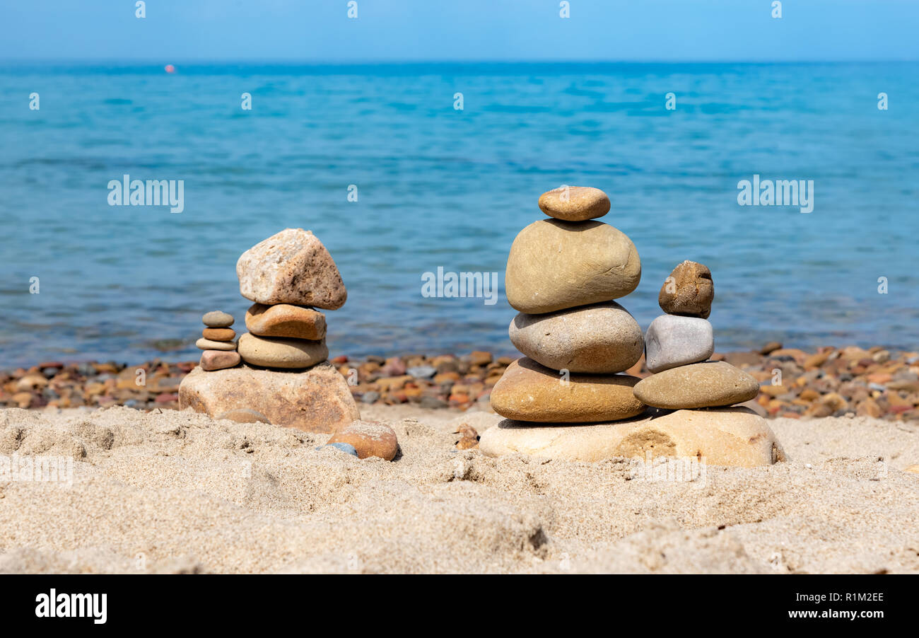 Balance stones art construction on the beach on Sicily island, Italy Stock Photo