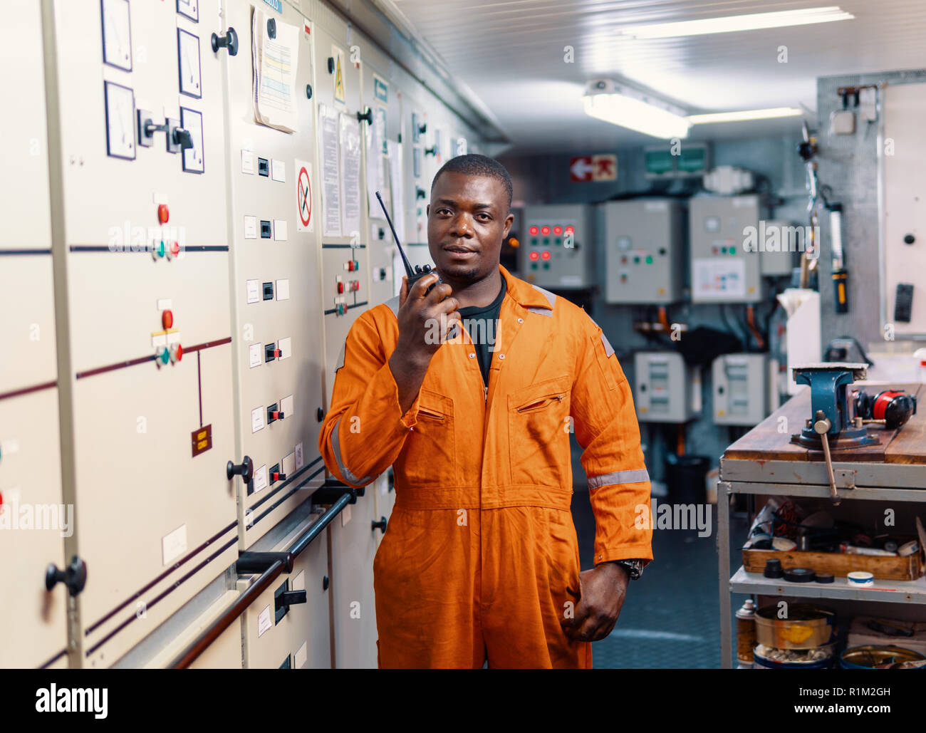 Marine engineer officer working in engine room Stock Photo Alamy