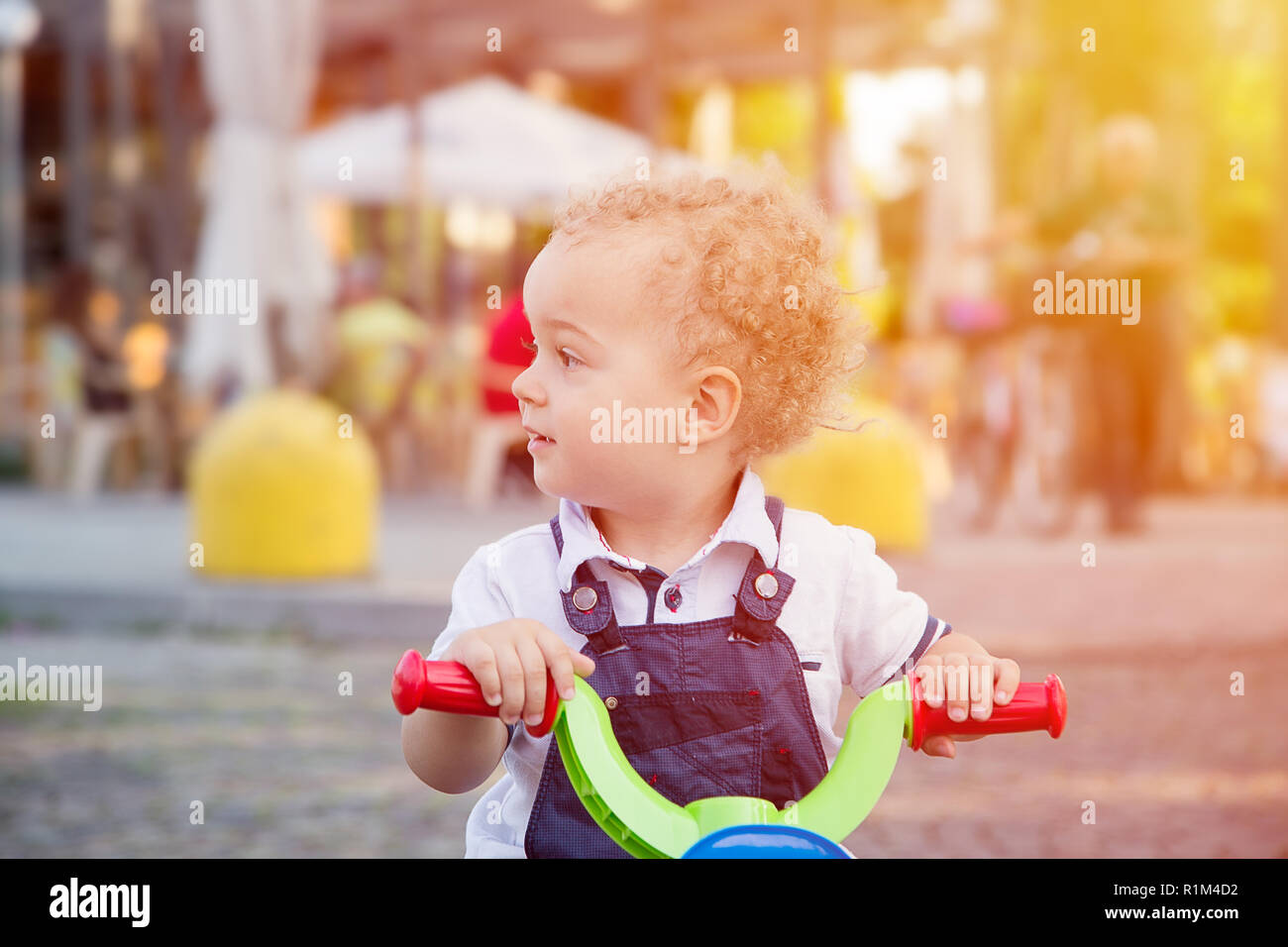 Baby Rider Outside Smiling children baby boy riding bicycle outdoor Stock Photo - Alamy