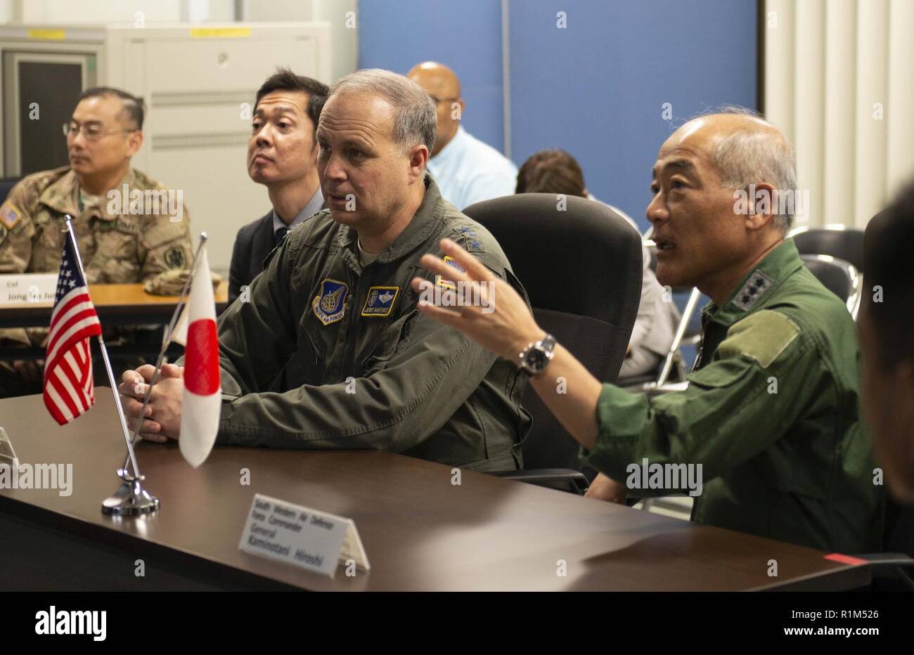Lt. Gen. Jerry Martinez, U.S. Forces, Japan, commander, attends a briefing at Naha Air Base, Japan, Oct. 15, 2018, with Japan Air Self Defense Force leadership. Martinez visited the base to recognize the life saving actions and role of the rescue squadron in a situation with a U.S. downed pilot. Stock Photo