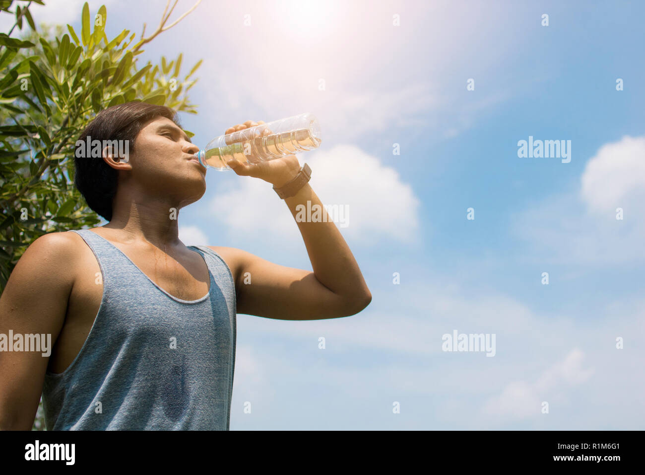 sport man drinking water after running Stock Photo Alamy