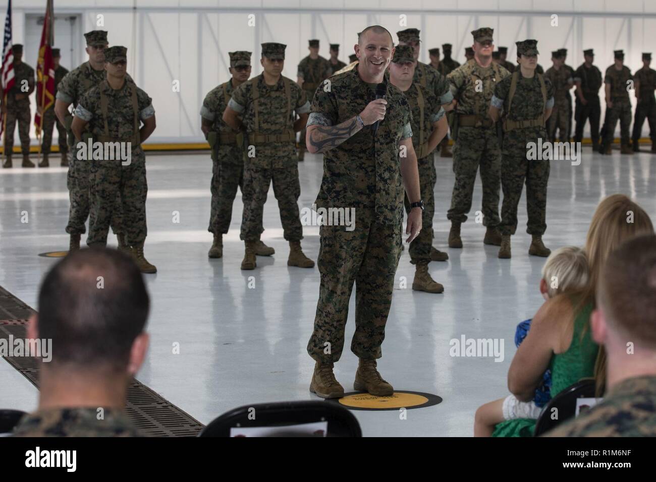 U.S. Marine Corps Sgt. Maj. Phillip Anderson, the newly appointed squadron sergeant major of Marine Medium Tiltrotor Squadron (VMM) 363, speaks to guests during an appointment ceremony, Oct. 19, 2018. VMM-363, nicknamed the Lucky Red Lions, arrived to Hawaii earlier this year increasing the combat capability and crisis response within the Indo-Pacific region. Stock Photo
