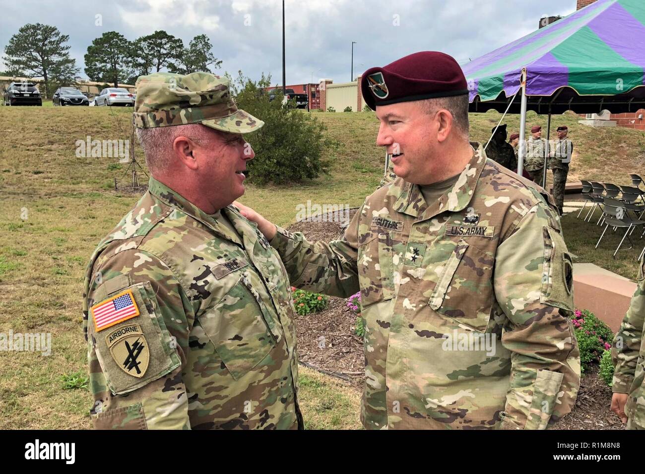 Maj. Gen. Darrell Guthrie, right, commanding general of United States Army Civil Affairs and Psychological Operations Command (Airborne), speaks to Brig. Gen. Richard Sele, USACAPOC(A) deputy commanding general, who retired after 33 years of service during a ceremony Saturday, Oct. 20, 2018 at the USACAPOC(A) headquarters building on Fort Bragg, N.C. Stock Photo