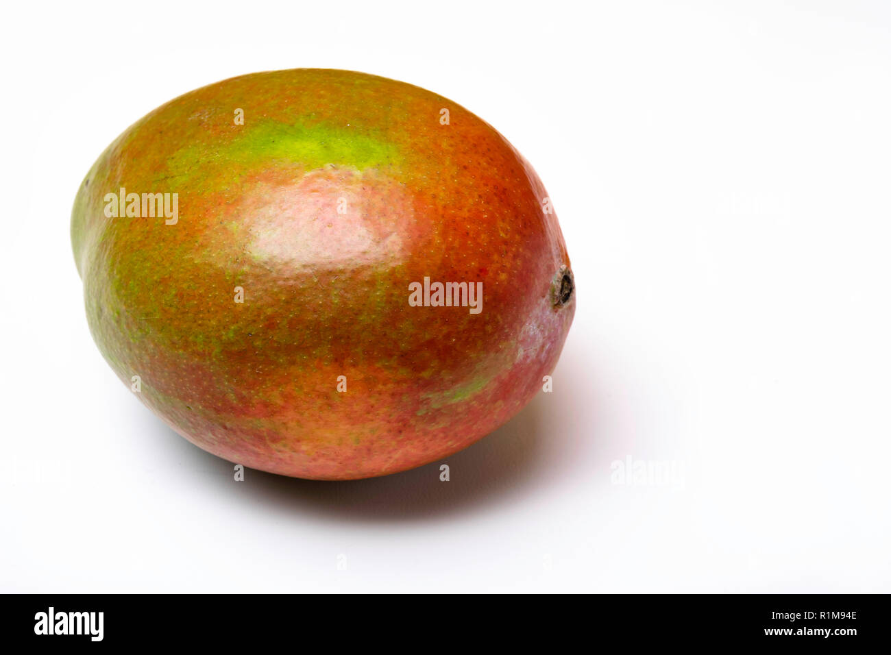 single ripe mango isolated on white background, copy space Stock Photo ...