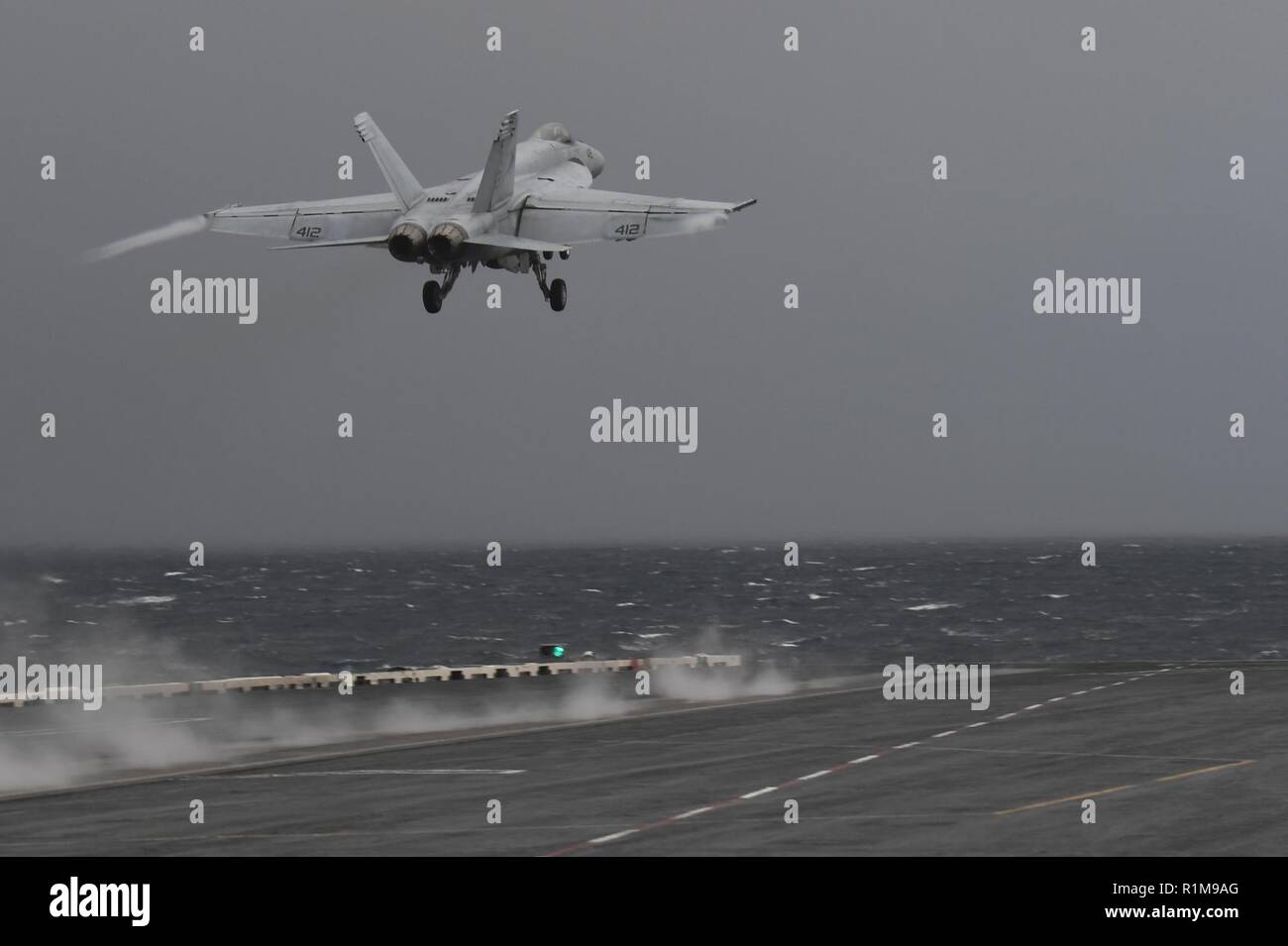 NORWEGIAN SEA (Oct. 22, 2018) An F/A-18E Super Hornet, assigned to the “Sunliners” of Strike Fighter Squadron (VFA) 81, launches from the Nimitz-class aircraft carrier USS Harry S. Truman (CVN 75). Currently operating in the U.S. Sixth Fleet area of operations, Harry S. Truman will continue to foster cooperation with regional allies and partners, strengthen regional stability, and remain vigilant, agile and dynamic. Stock Photo
