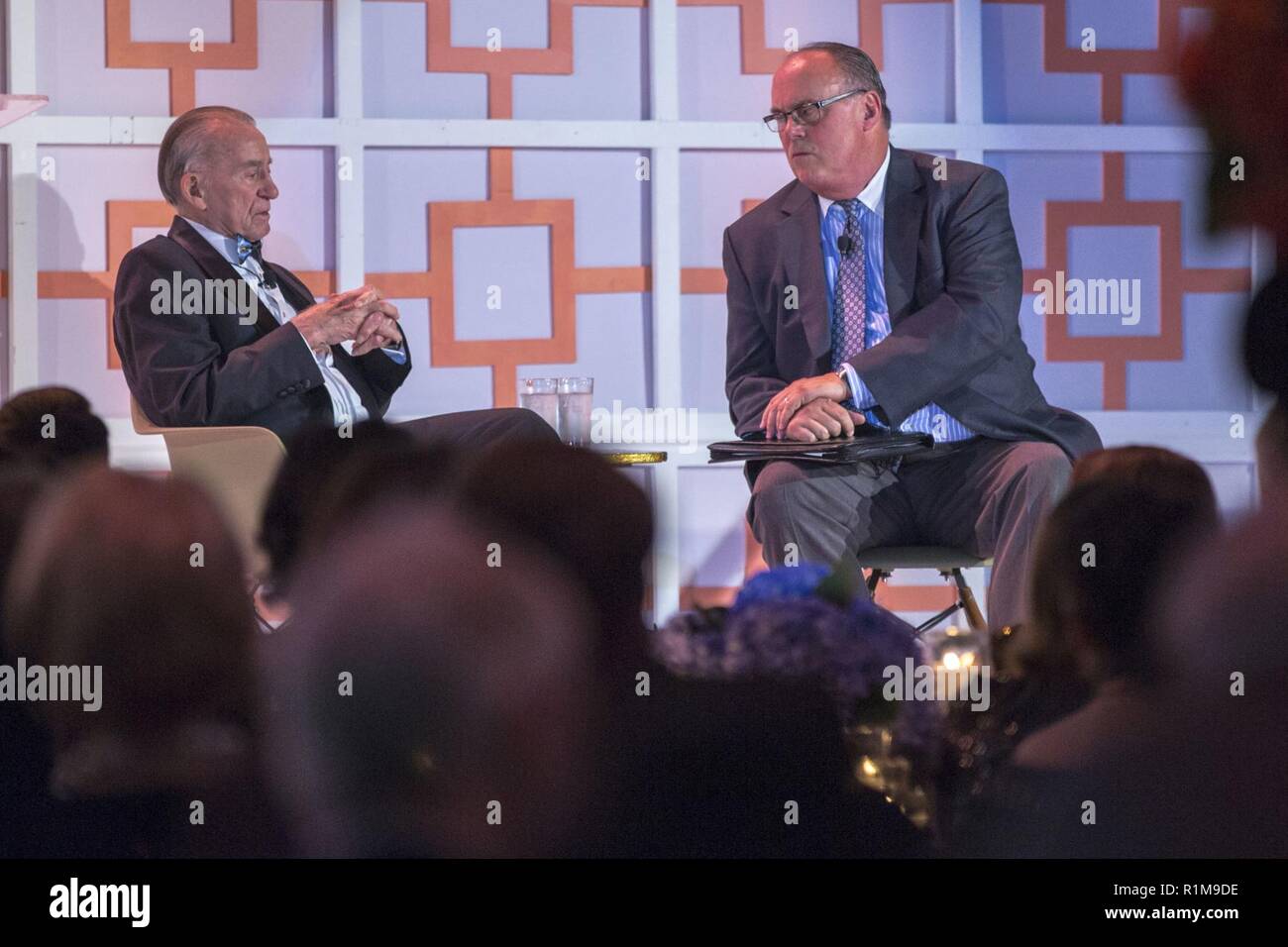 Mark Davis (right), a radio host from 660 AM The Answer, interviews Col Walter Cunningham (left), United States Marine Corps retired fighter pilot and Apollo 7 lunar module pilot, about his experience during the Apollo 7 mission at the Frontiers of Flight Museum in Dallas, Oct. 20, 2018. Apollo 7 was the only manned Apollo mission launched on a Saturn 1-B rocket and from pad 34 at Cape Kennedy. It was the first manned test of the Command and Service Module. The crew orbited the Earth 163 times and spent 10 days and 20 hours in space. It also featured the first live TV from a manned spacecraft. Stock Photo