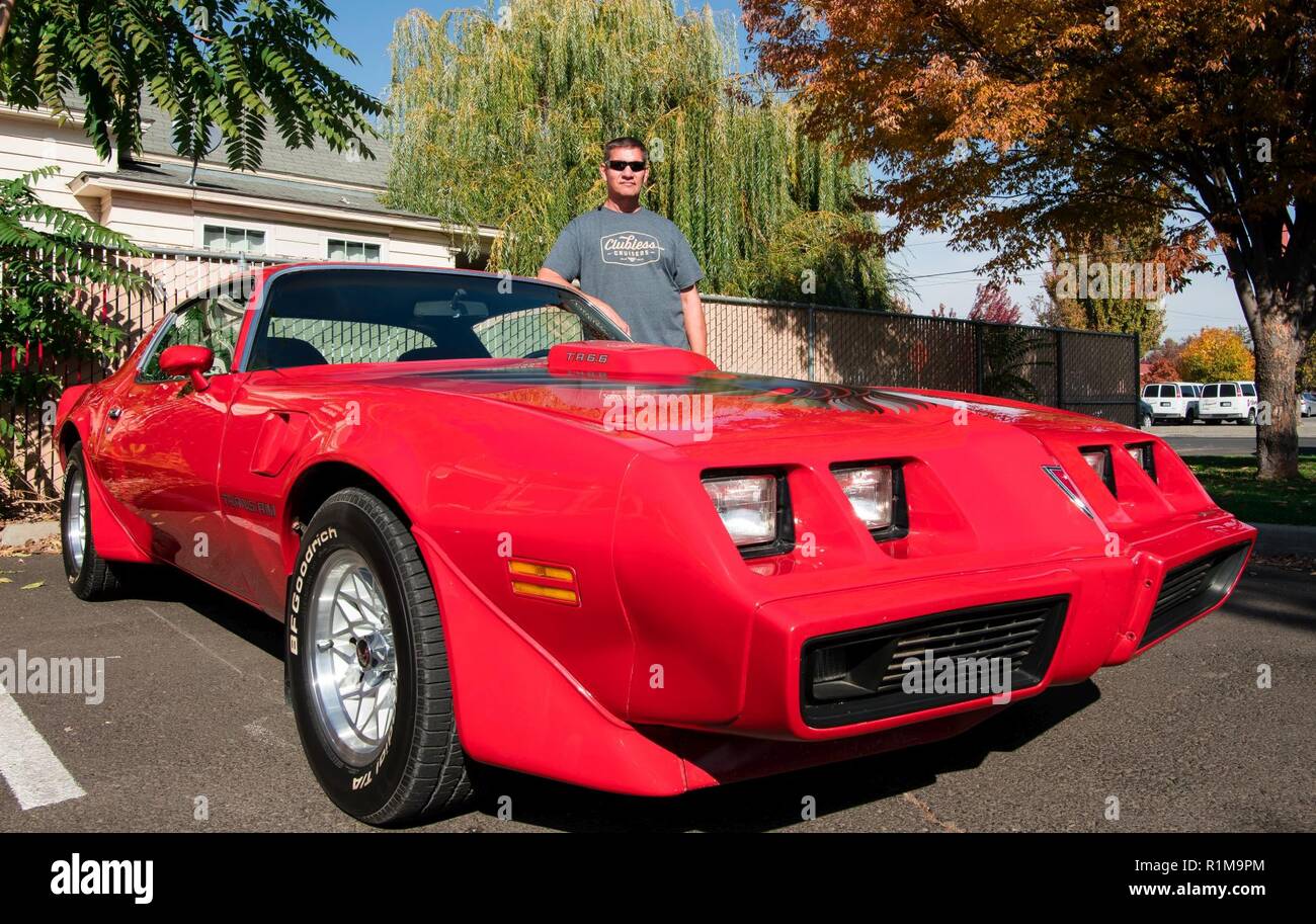 John Berglin, mechanical engineer shows off his 1979 Pontiac, Firebird Trans Am. It’s his favorite car because it’s “fast, it’s a lot of fun to drive, and it’s loud.” John was one of the 15 U.S. Army Corps of Engineers Walla Walla District employees who participated in the “Wheels to Work” day, on October 19, 2018, in Walla Walla, Washington. Stock Photo