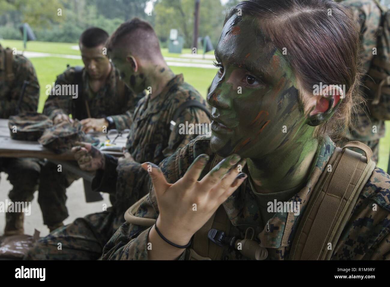 https://c8.alamy.com/comp/R1M9RY/a-naval-reserve-officers-training-corps-midshipmen-from-tulane-university-applies-camouflage-paint-before-small-unit-leadership-evaluations-at-hopper-park-in-baton-rouge-la-october-20-2018-marines-from-marine-forces-reserve-in-new-orleans-assisted-in-the-sules-to-provide-experience-and-insight-for-midshipman-to-better-prepare-them-for-officer-candidate-school-and-for-their-future-military-careers-R1M9RY.jpg