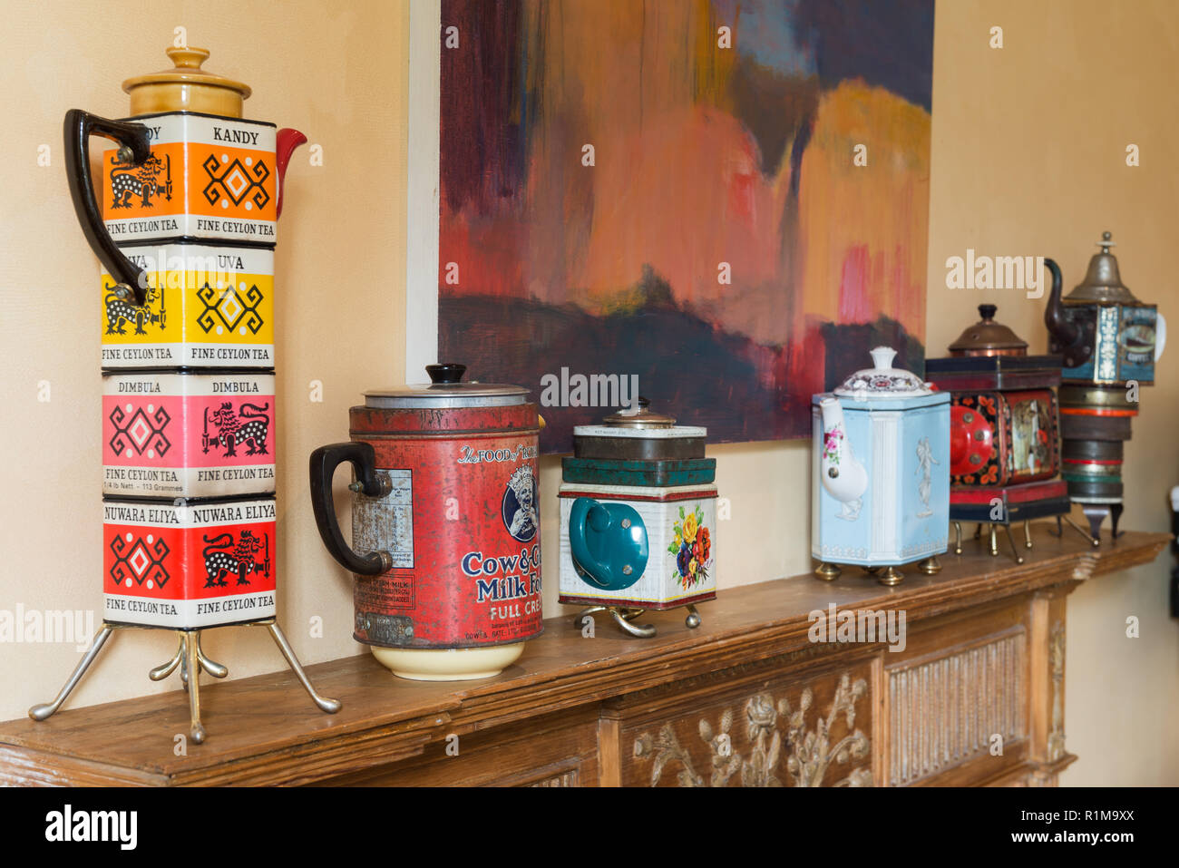 Tea pot collection on mantelpiece Stock Photo