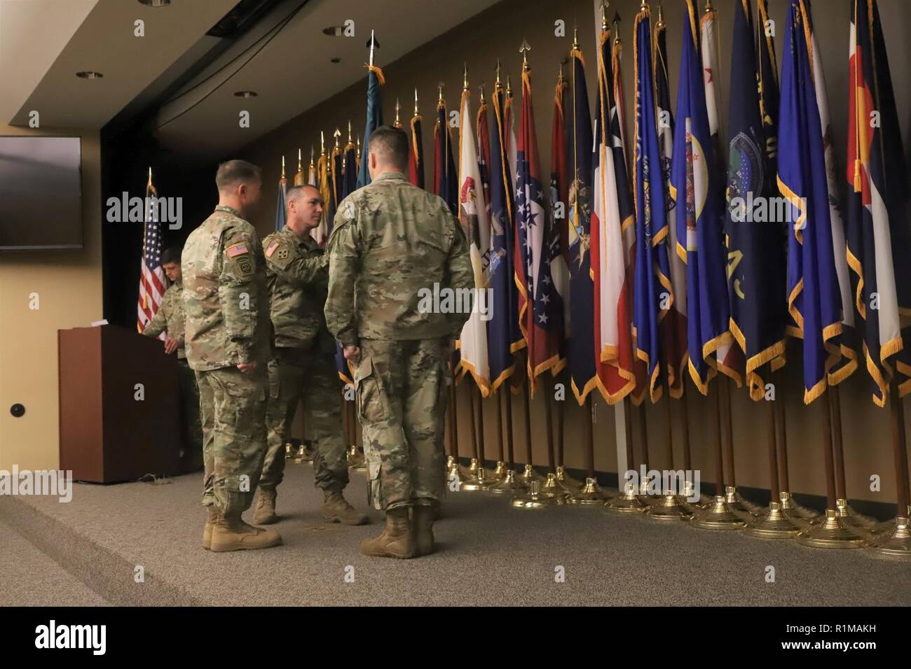 Command Sgt. Maj. Brad Owens passes the U.S. Army Security Assistance ...