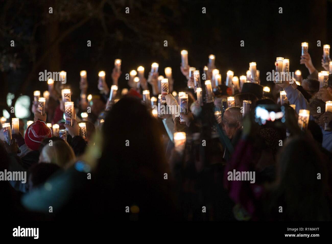 Service members, veterans and families attend a candlelight vigil