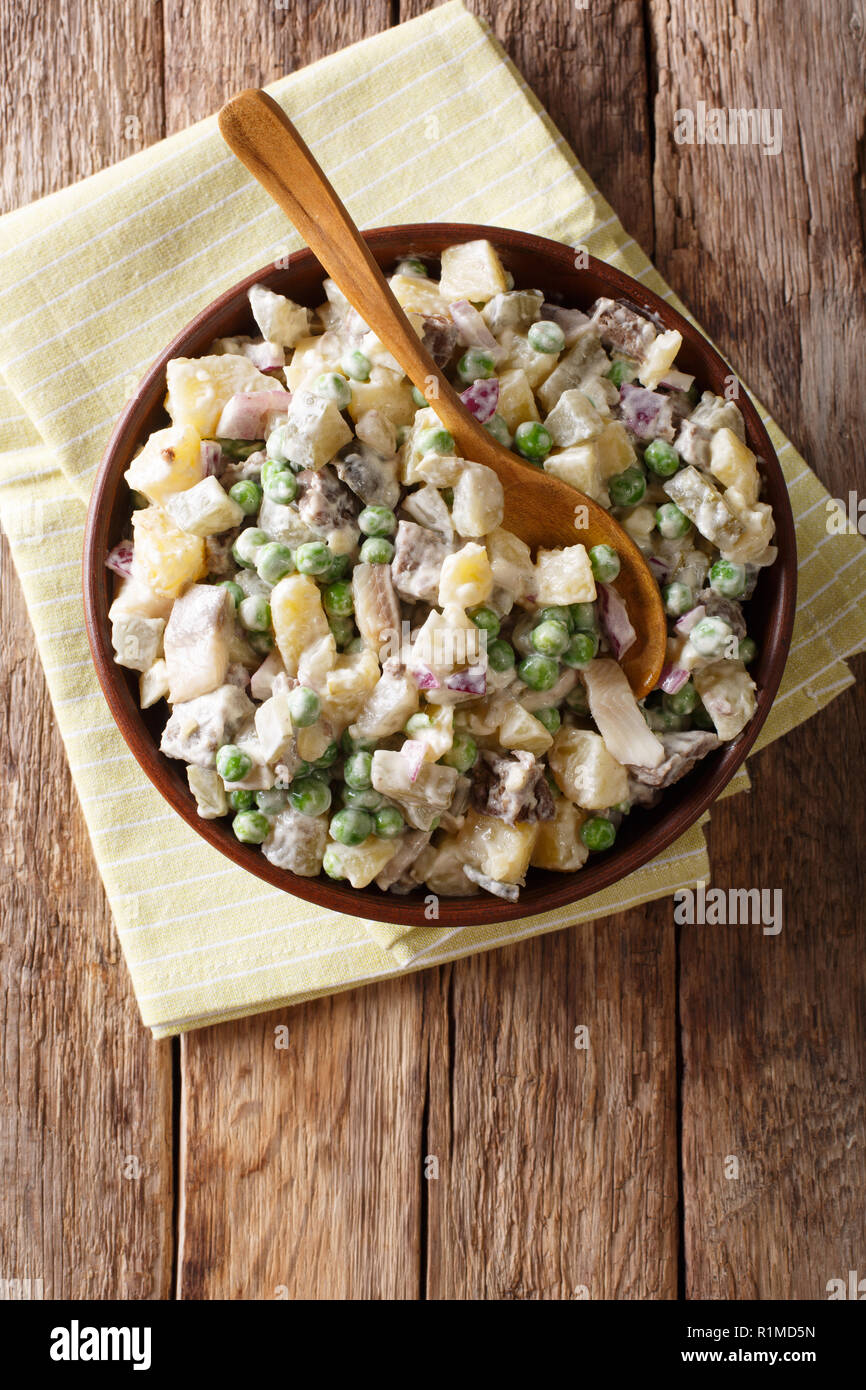 Close-up of Latvian Baltic salad rosols made from vegetables, herring and  beef in a bowl on the table. Vertical top view from above Stock Photo -  Alamy