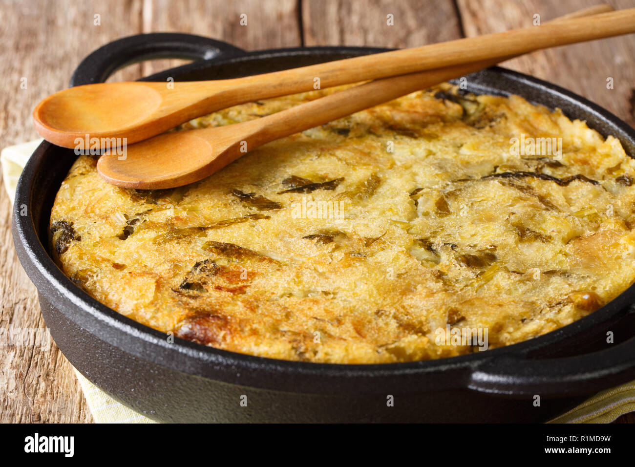 English Bubble and Squeak of baked mashed potatoes with cabbage and  brussels sprouts close-up in a pan. horizontal Stock Photo - Alamy