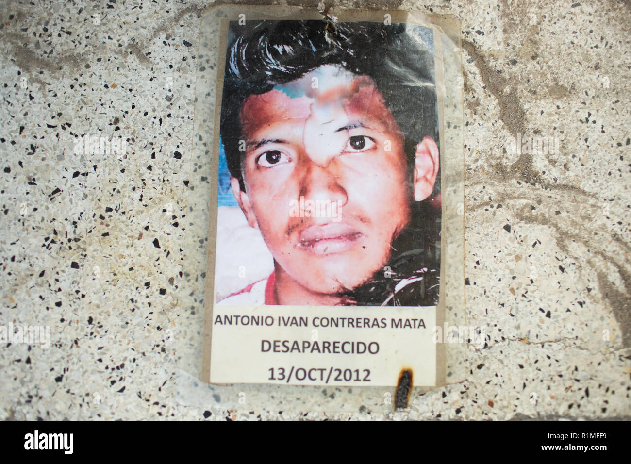 A photo of Antonio Ivan Contreras Mata, who went missing in Iguala, Guerrero, Mexico, October 3, 2012 from the area. He was 28 years old.   A few days prior to Antonio Ivan's disappearance he received a phone call inviting him to work with an organized crime group. Antonio said that he had three children and did not want to be involved in this life style. Guadalupe can not be certain, but he thinks this is possibly what created problems for his son.   Photo captured in Iguala, Guerrero, Mexico, February 6, 2016. Stock Photo