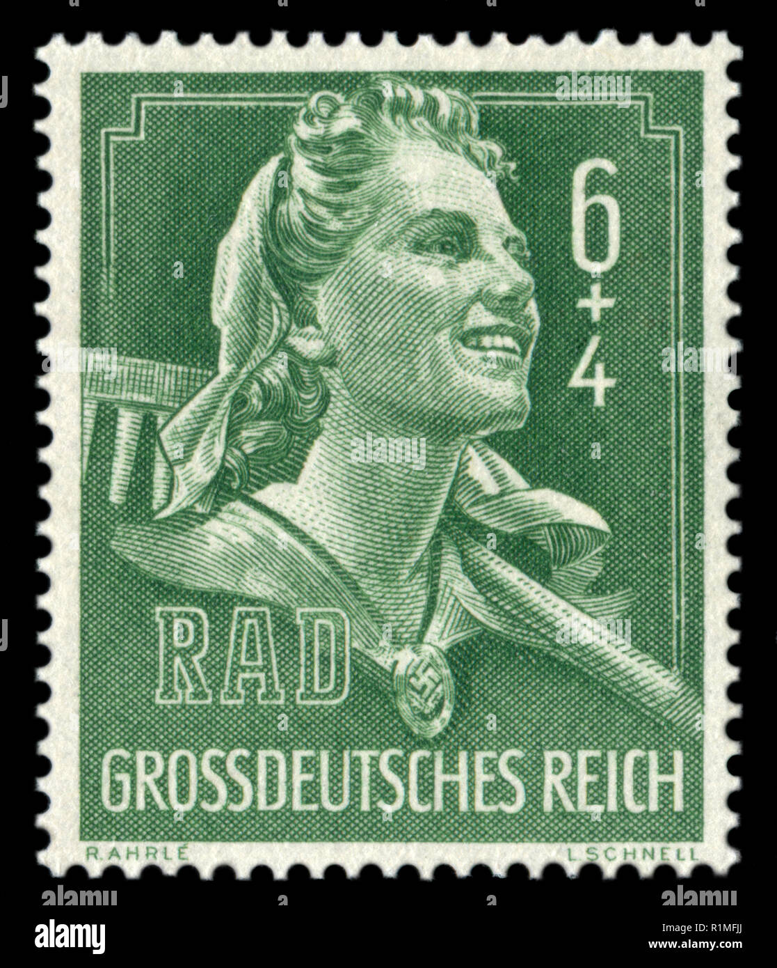 German postage stamp: Woman RAD service worker in uniform with a rake on his shoulders, fair labor brigades, 1944, Germany, the Third Reich, ww2 Stock Photo