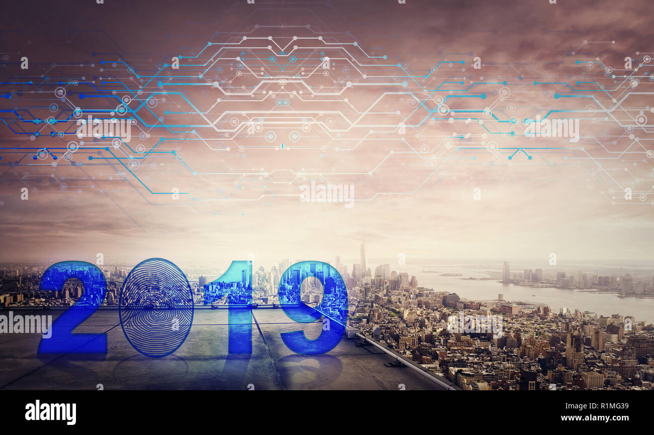Blue 2019 icon hologram on the rooftop of a skyscraper over the big city sunset horizon, double exposure effect. Unlock the new year and start busines Stock Photo