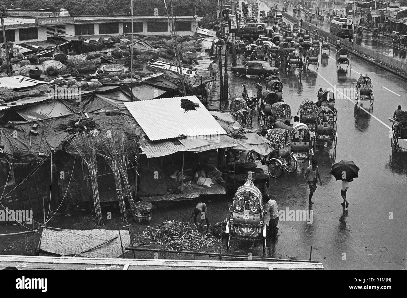 Dhaka New Market in monsoon rain 1980 Stock Photo