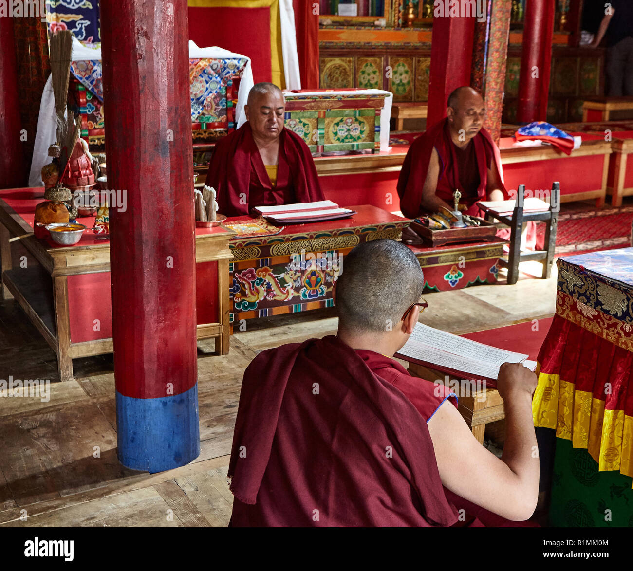 Buddhist monks creating a mandala of colored sand in Lamayuru monastery