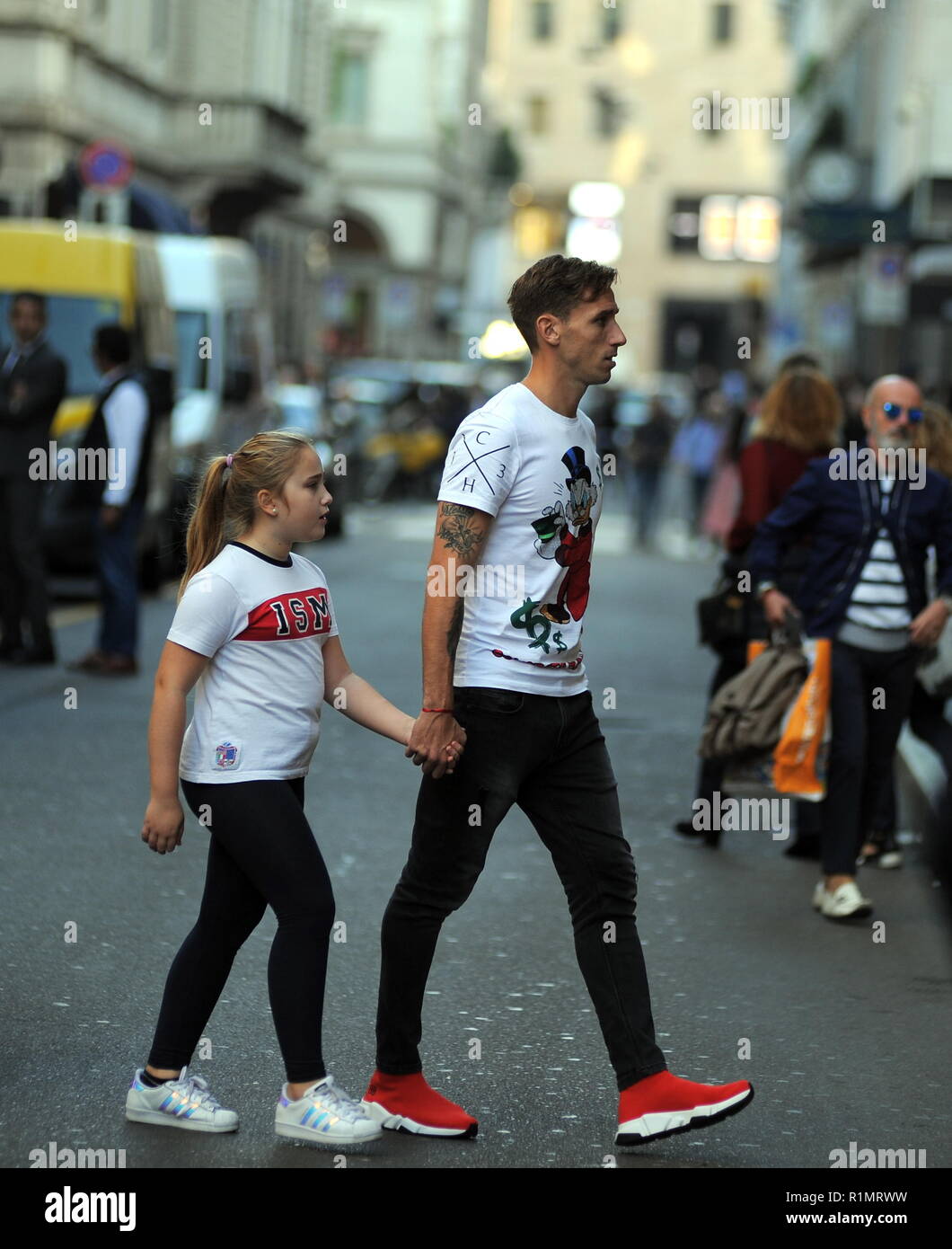 Footballer Lucas Biglia of Milan and National Argentina walks through via Montenapoleone with his wife Cecilia Ambrosio and his kids Allegra and Alessio and then they stop at a cafe  Featuring: Lucas Biglia, Allegra Biglia Where: Milan, Italy When: 13 Oct 2018 Credit: IPA/WENN.com  **Only available for publication in UK, USA, Germany, Austria, Switzerland** Stock Photo
