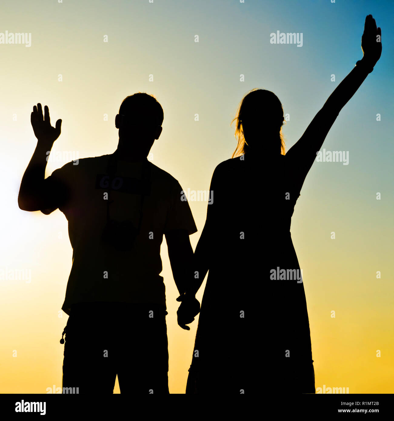 Silhouette of a man and woman sunrise hi-res stock photography and ...
