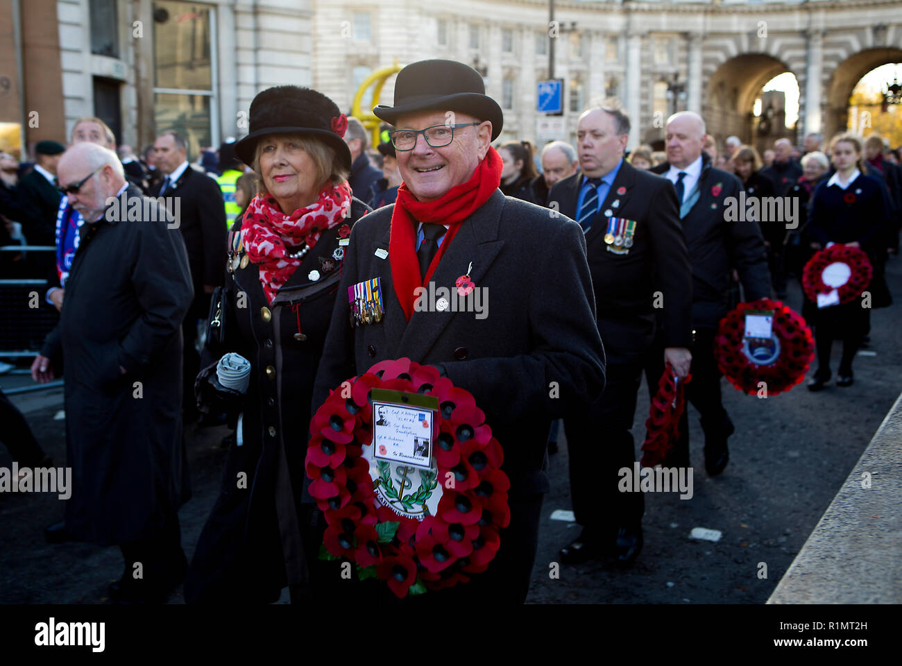 London, England, UK - 11th Nov 2018. Participants carrying wreaths of poppies in the Remembrance Day Celebrations walking from Admiralty Arch into Horse Guards Parade to honour the Centennial of Armistice Day 1918. (Photo © Michael Cole) Stock Photo