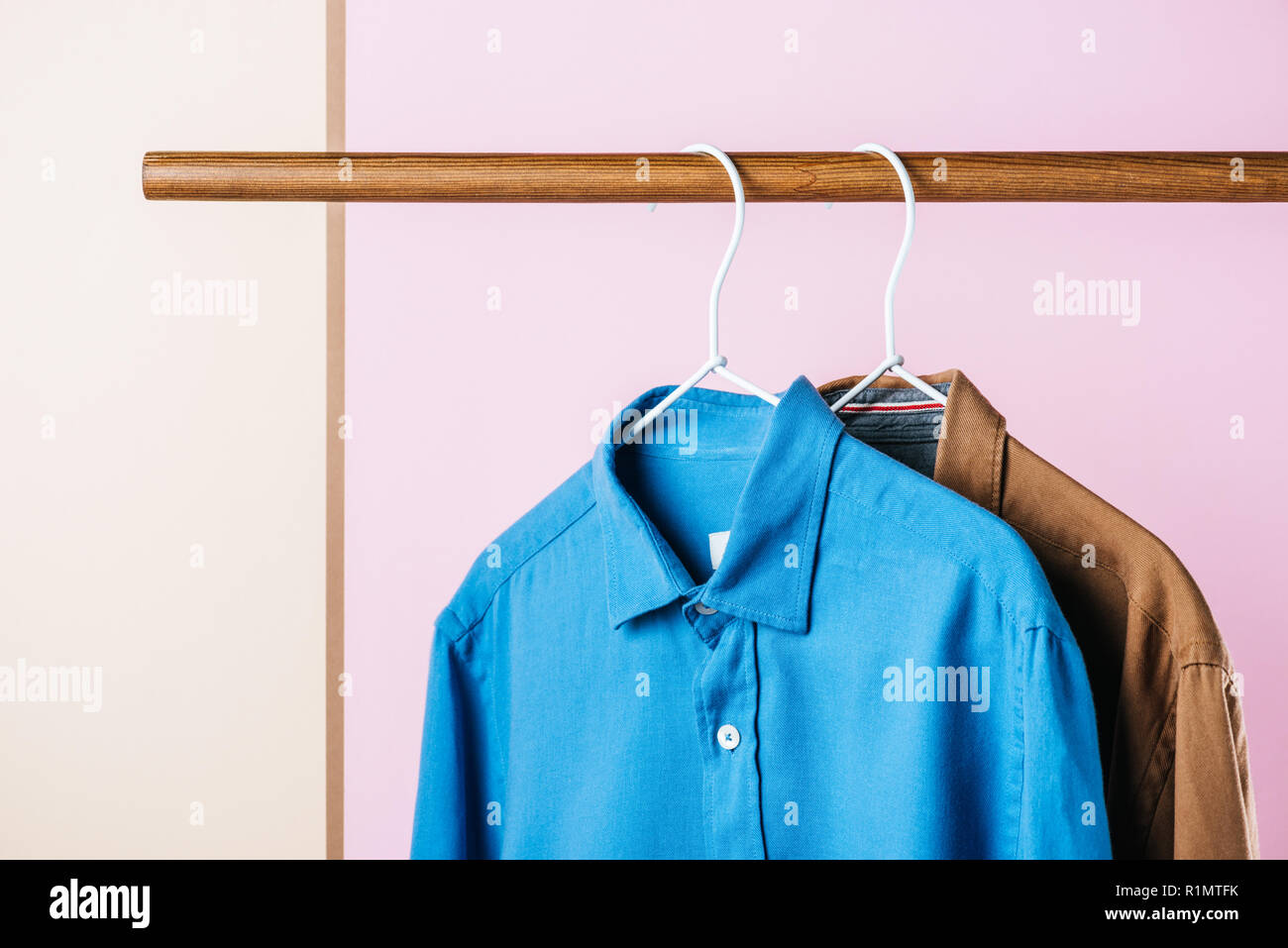 casual shirts on hangers, fashion industry Stock Photo