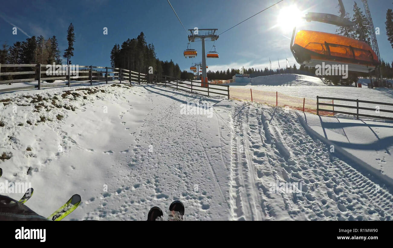 Winter Alpine ski resort. Traditional red cabin lifts Stock Photo Alamy