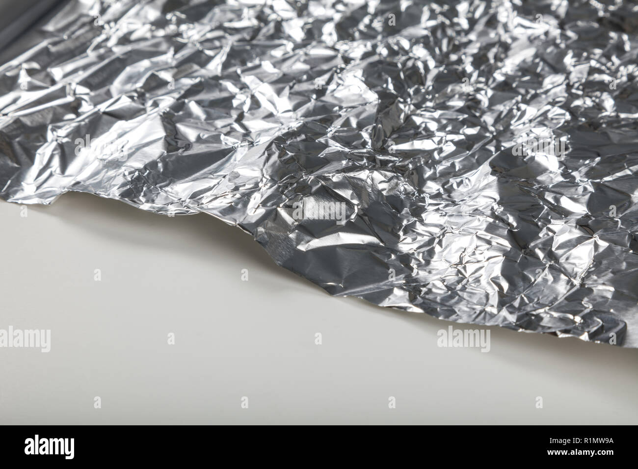 Aluminum foil roll for background, close up. Stock Photo