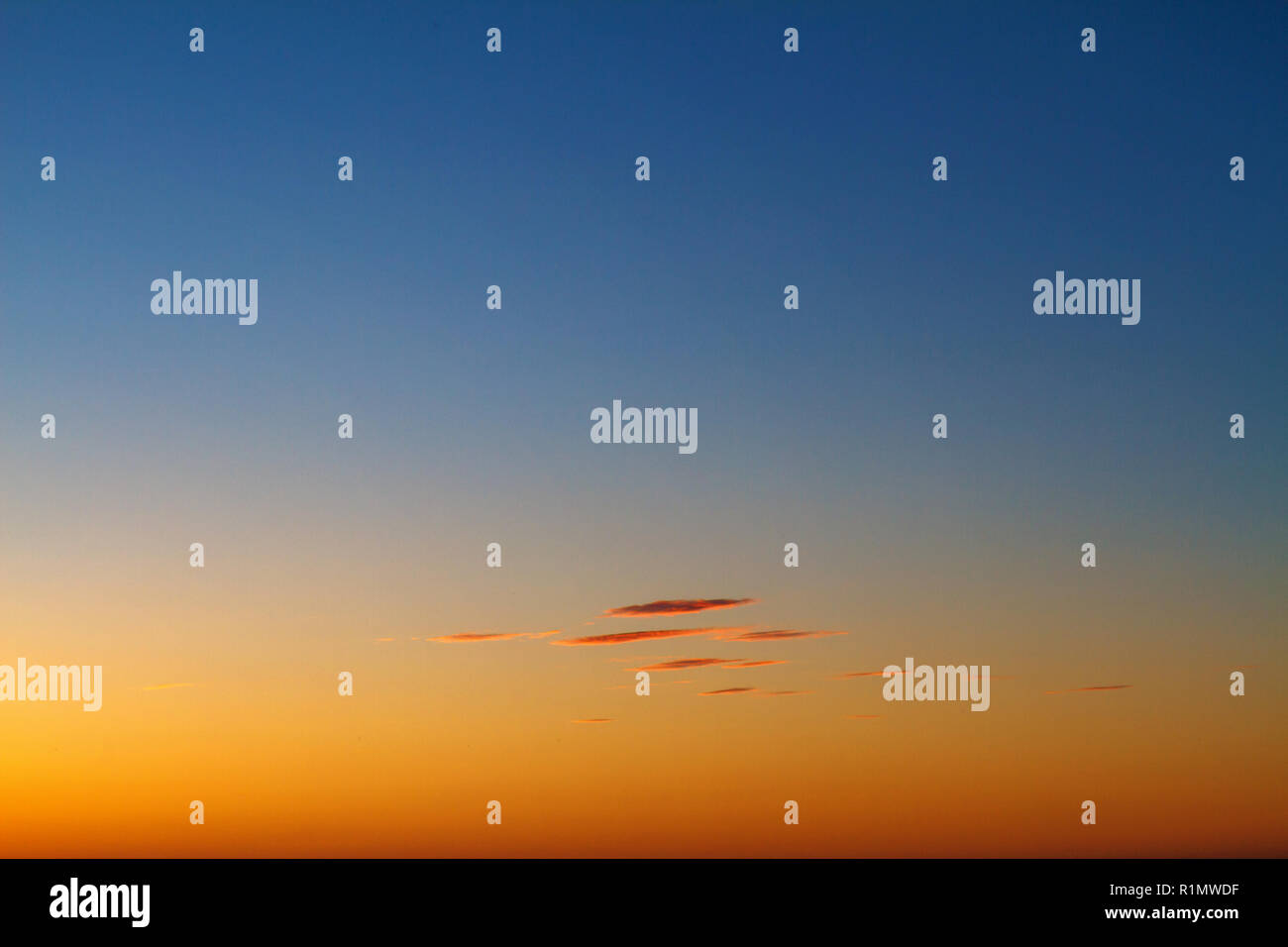 beautiful sunset clouds in the sky over the sea, bright colors of ...