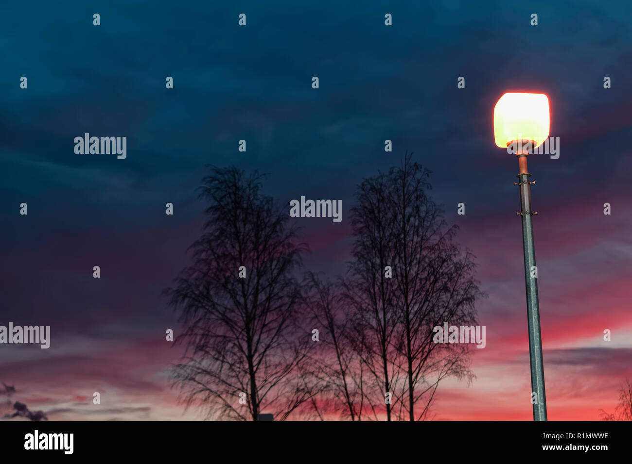 The sky with dark clouds illuminated by the setting sun Stock Photo - Alamy