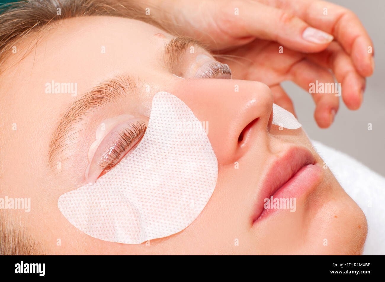 Eyelash care treatment procedures. Woman doing eyelashes lamination