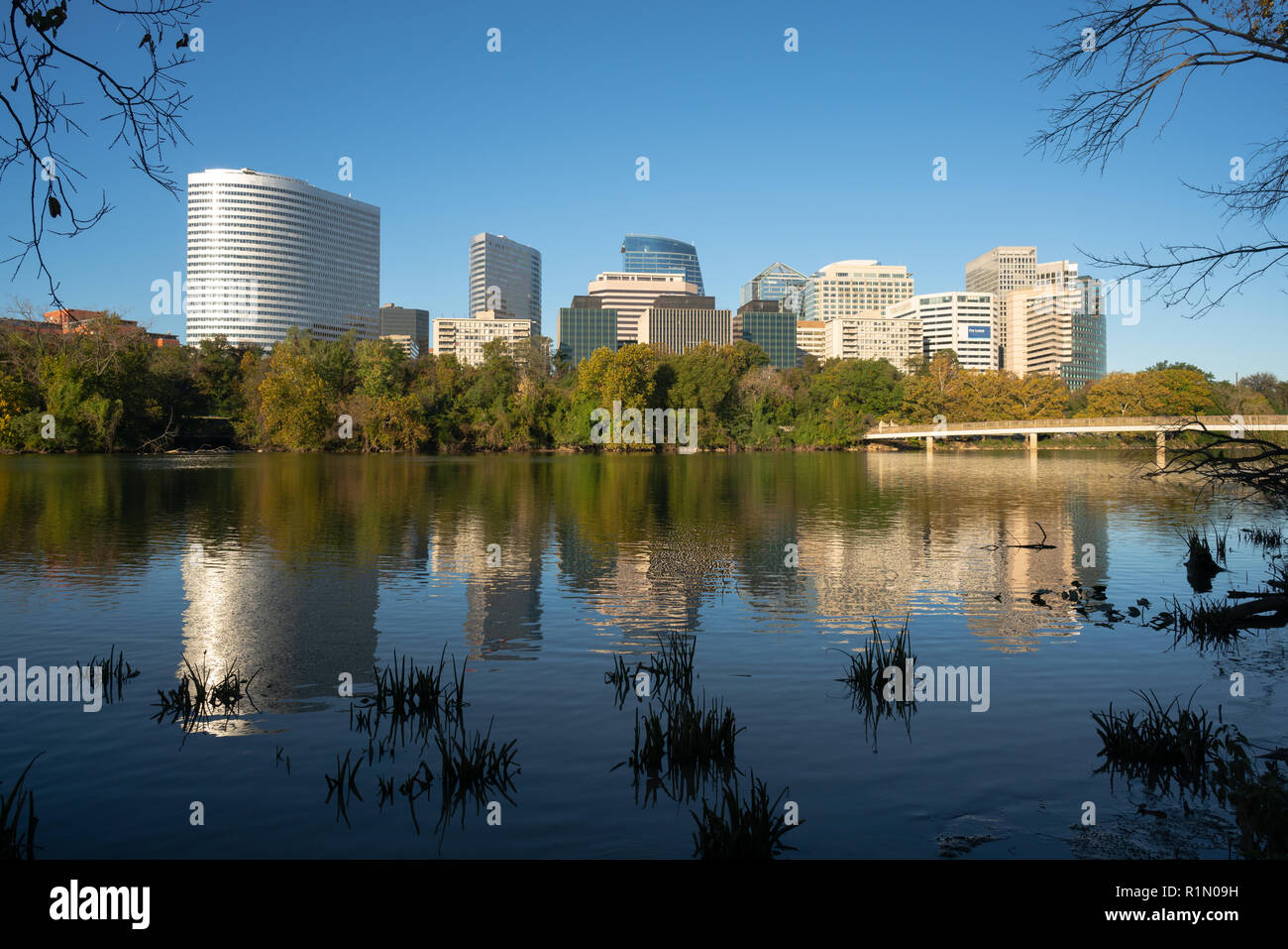 The smooth flowing Potomac River reflects the buildings of Arlington Virginia Stock Photo
