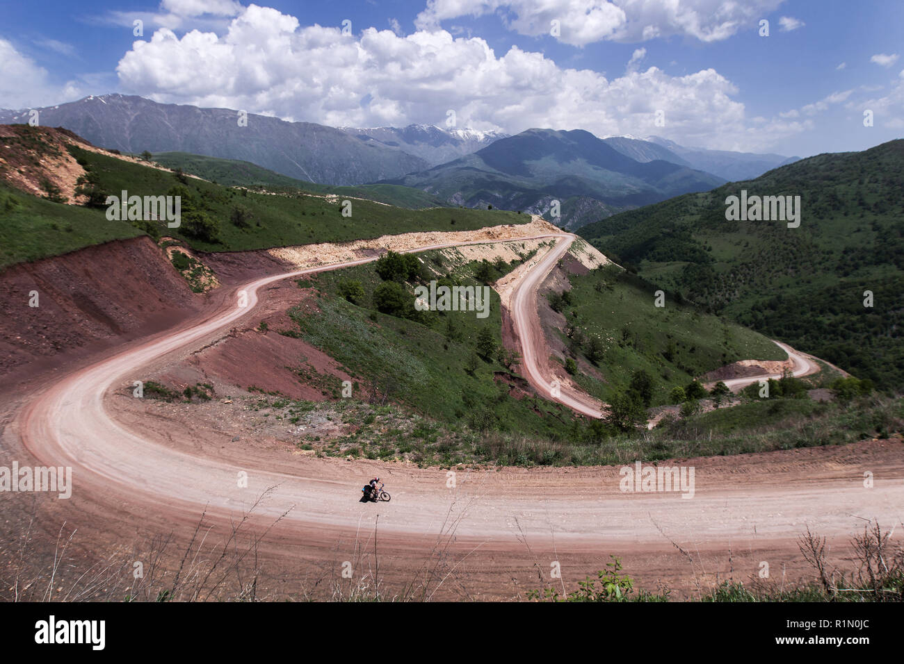 Bike tour in Nagorno-Karabakh, hard way by long serpentine road in mountains Stock Photo