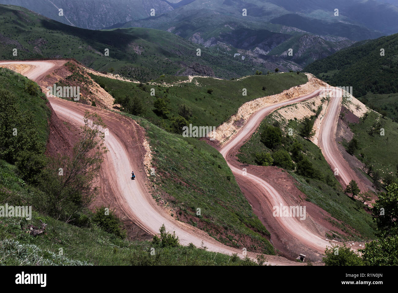 Bike tour in Nagorno-Karabakh, hard way by long serpentine road in mountains Stock Photo