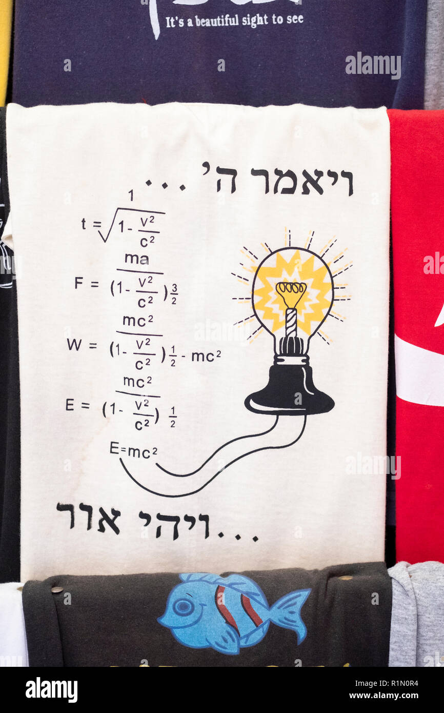 A t shirt for sale in the old City linking religion & scince. The Hebrew reads, "God said...and there was light." In Jerusalem, Israel. Stock Photo