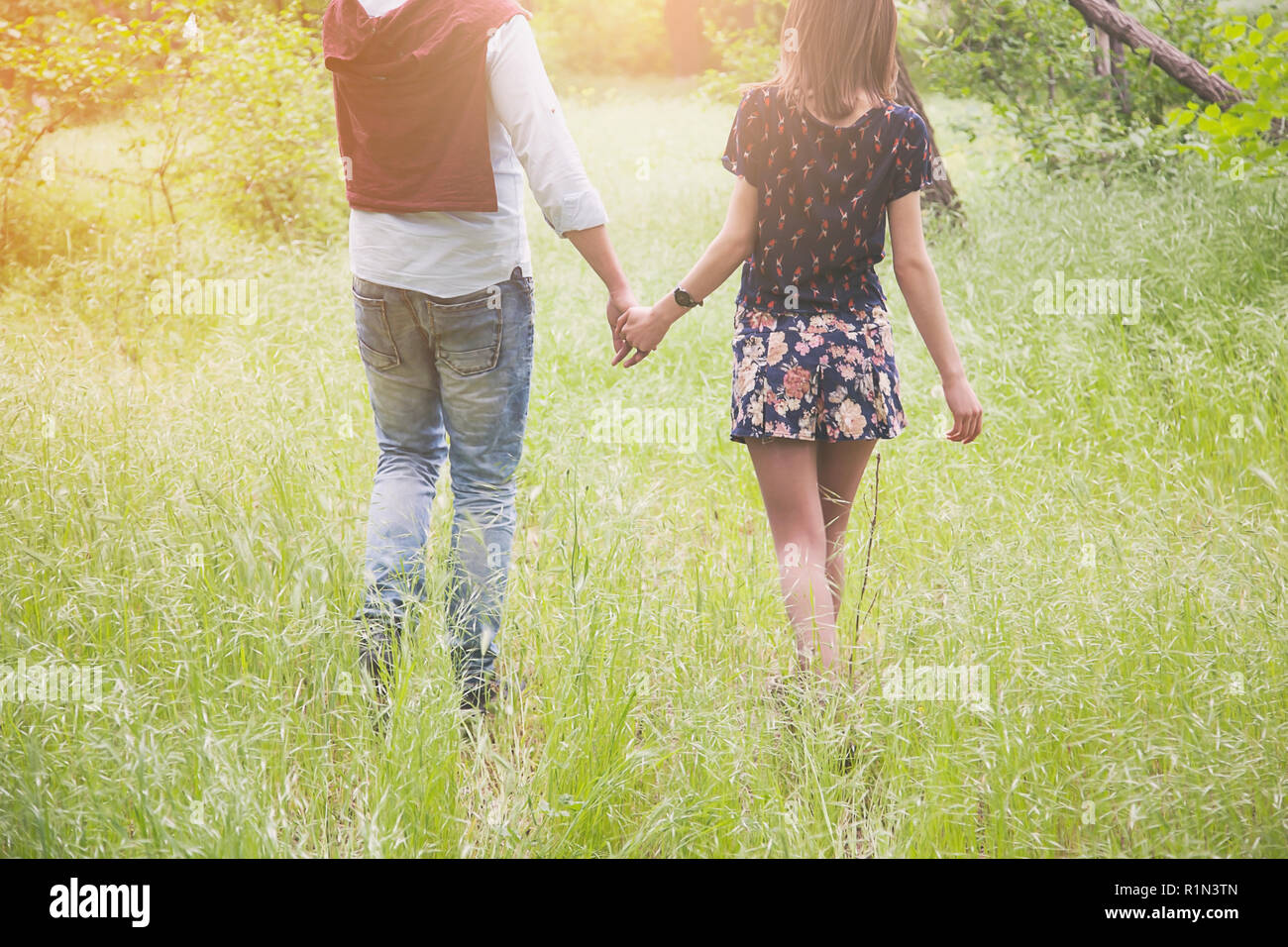 Teen couple walking holding hands hi-res stock photography and images ...