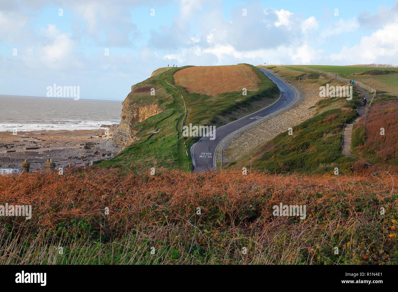 The winding access road to Dunraven/Southerndown bay with its castle ruins and famouse walled gardens in a picturesque area near Bridgend. Stock Photo