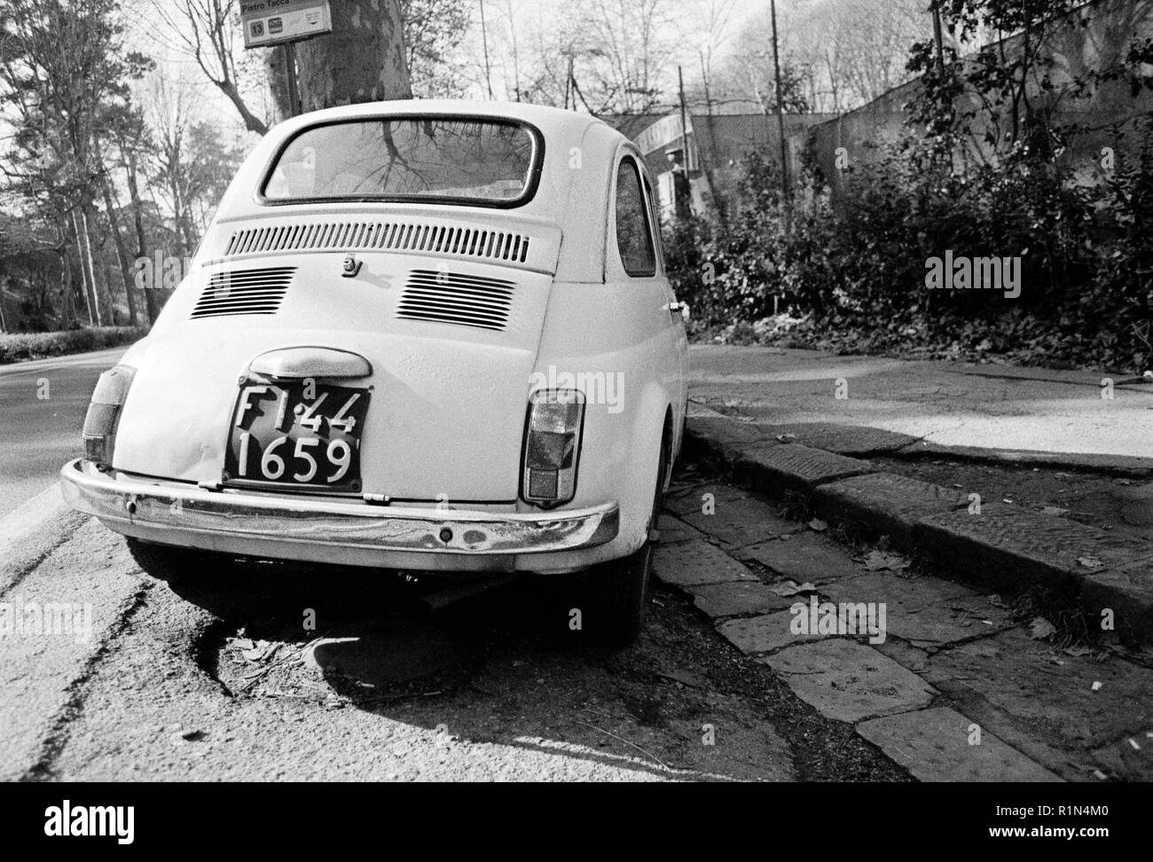 White outdoor model in the traffic. Fiat 500 last century vintage car ...