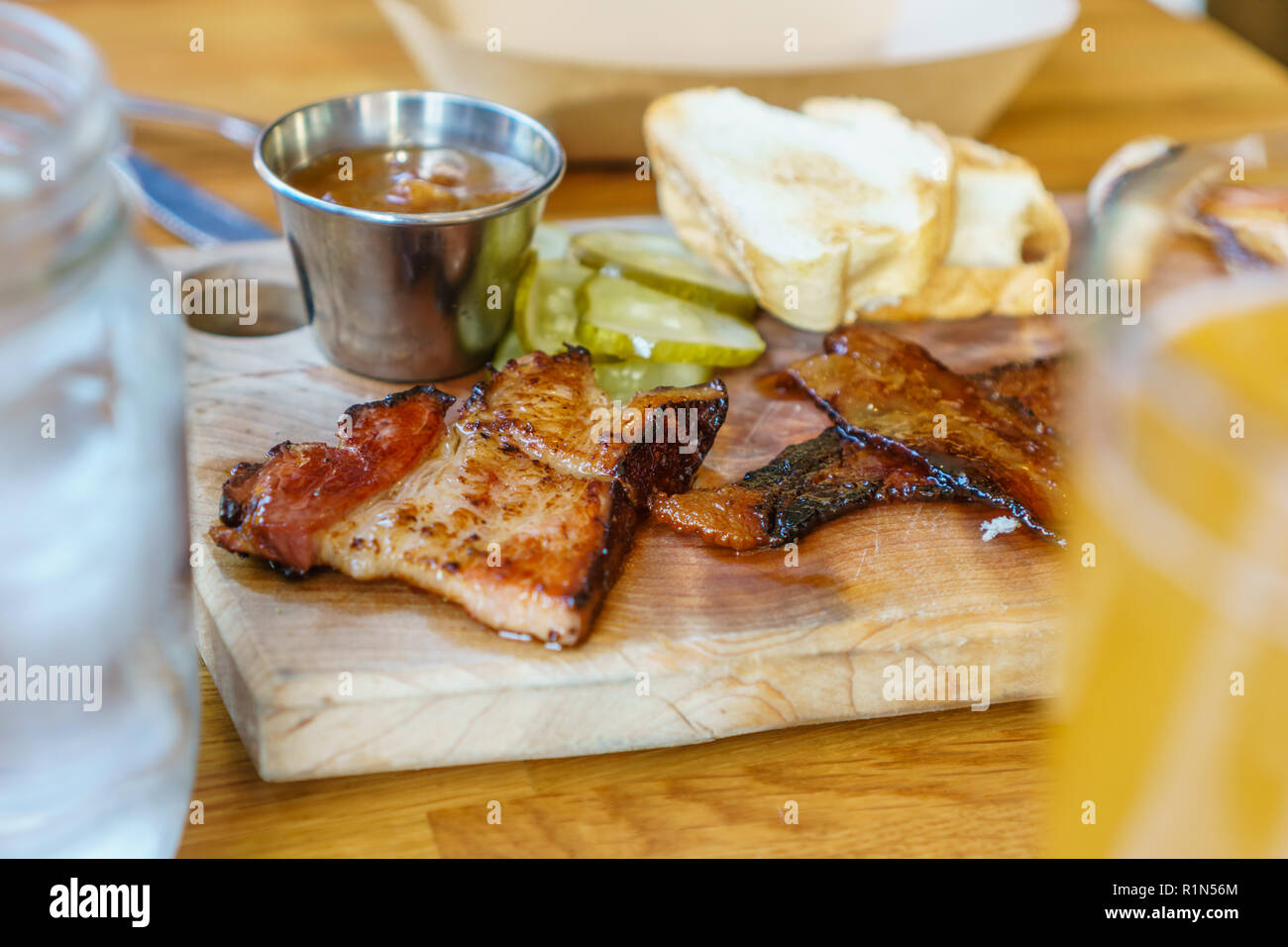 Close up view of charcuterie board on a restaurant table with several different types of