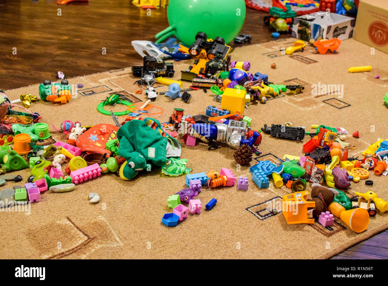 Childrens toys on the carpet. Bardak in the childrens room Stock Photo -  Alamy